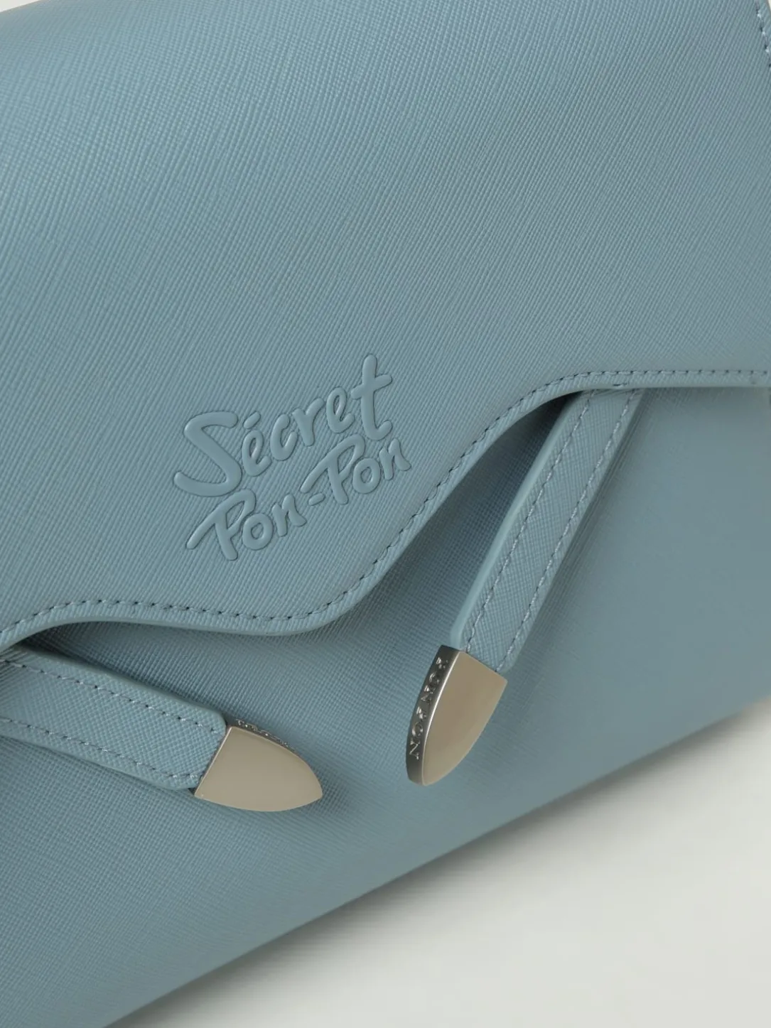 Borsa Quira Grain Small Secret Pon-Pon in pelle sintetica saffiano