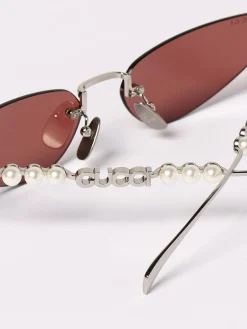 Occhiali da sole in metallo Gucci con perle